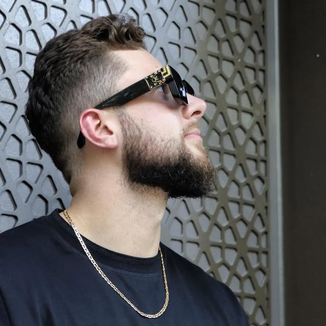 Andrey Kupchenko wearing sunglasses, looking upward